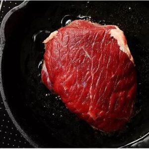 meat cooking on pan