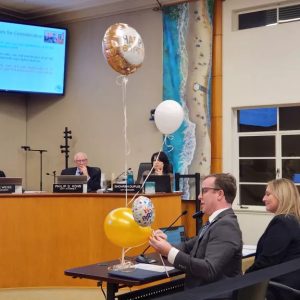 Jeremy Frimond, assistant to the city manager, demonstrates different types of balloons to the Laguna Beach City Council on Tuesday. (Andrew Turner)